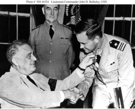Receives the Medal of Honor from President Franklin D. Roosevelt, circa July 1942. Bulkeley was awarded the medal for heroism while he commanded Motor Torpedo Boat Squadron Three during the Philippines Campaign, December 1941 - April 1942. U.S. Naval Historical Center Photograph.